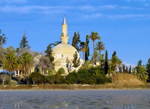 Hala Sultan Tekke is surrounded by a grove of cypress and palm trees along with the Larnaca salt lake.