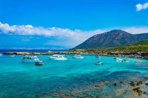 view of boats and mountains beyond