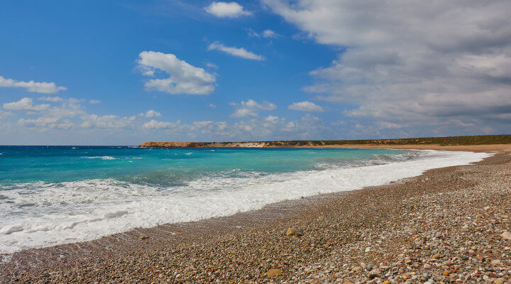 pebble filled beach at Lara Bay, Paphos in Cyprus