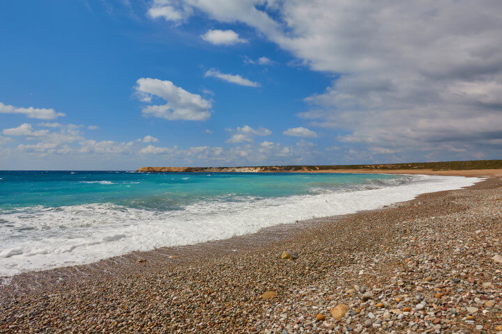 pebble filled beach at Lara Bay, Paphos in Cyprus